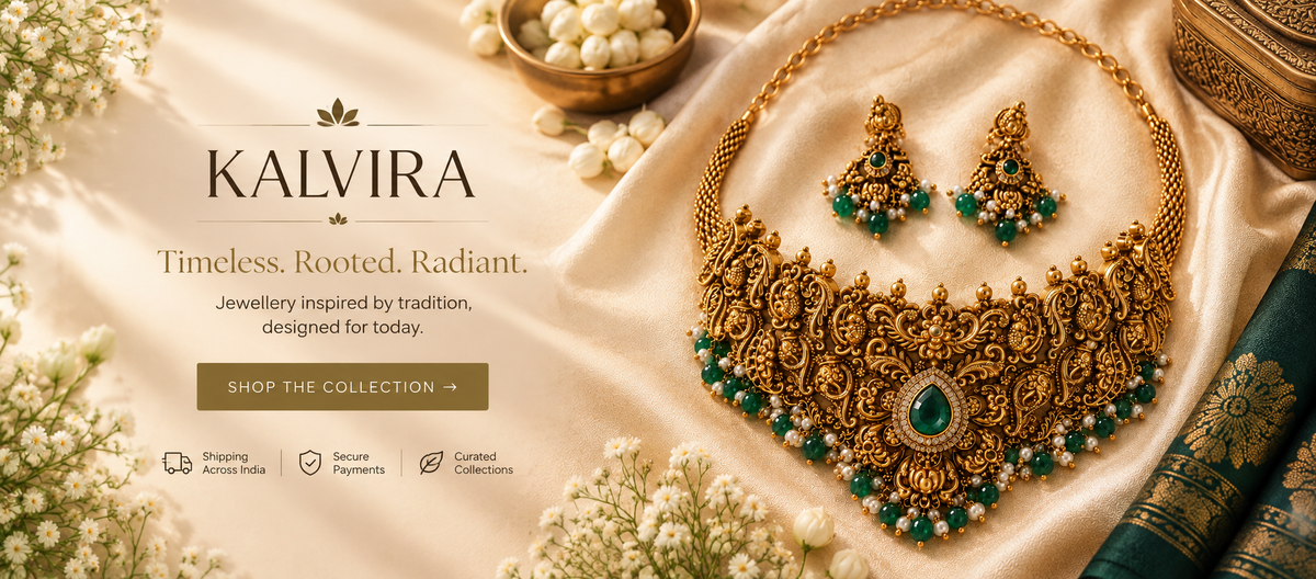 KALVIRA temple and antique jewellery necklace and earrings displayed on traditional fabric